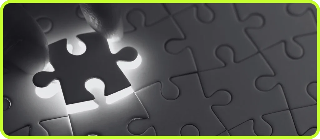 Hand placing the final puzzle piece, symbolizing problem-solving and overcoming challenges in web design